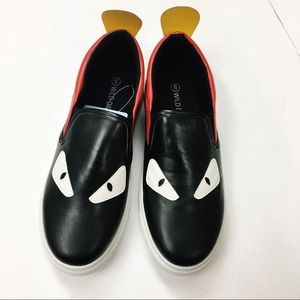 Black/Red slip on eye sneaker